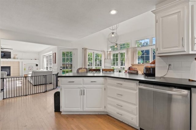 8443 Mettee St, Lenexa, KS 66219 - kitchen with dishwasher, dark countertops, healthy amount of natural light, recessed lighting, and light wood-style flooring