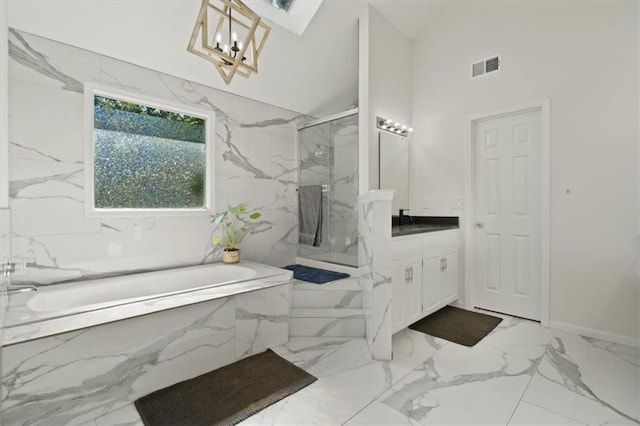 8443 Mettee St, Lenexa, KS 66219 - bathroom featuring vanity, a garden tub, a marble finish shower, marble tiled floors, and high vaulted ceiling