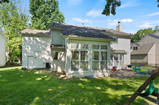 8443 Mettee St, Lenexa, KS 66219 - rear view of property featuring a patio, roof with shingles, a chimney, and central air condition unit