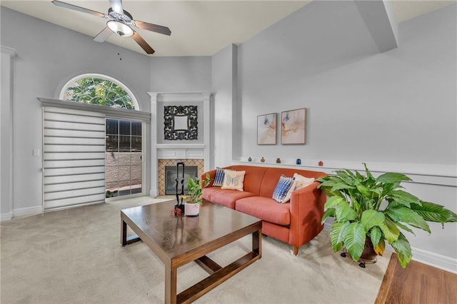 15828 W 61st St, Shawnee, KS 66217 - living area with a fireplace, ceiling fan, and baseboards