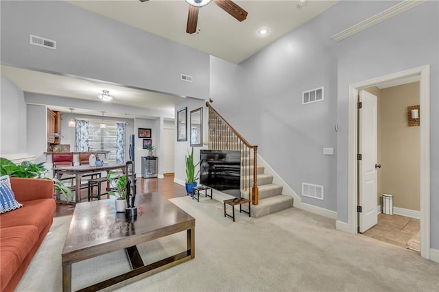 15828 W 61st St, Shawnee, KS 66217 - living room with stairway, ceiling fan, light colored carpet, and baseboards
