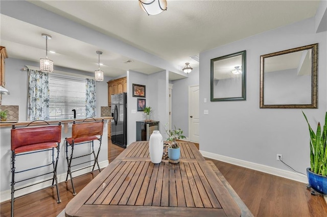15828 W 61st St, Shawnee, KS 66217 - dining area featuring wood finished floors and baseboards