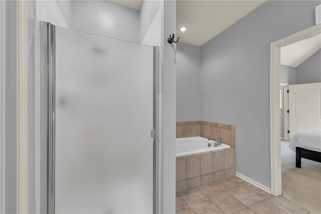 15828 W 61st St, Shawnee, KS 66217 - full bathroom with a stall shower, a bath, ensuite bath, tile patterned flooring, and baseboards