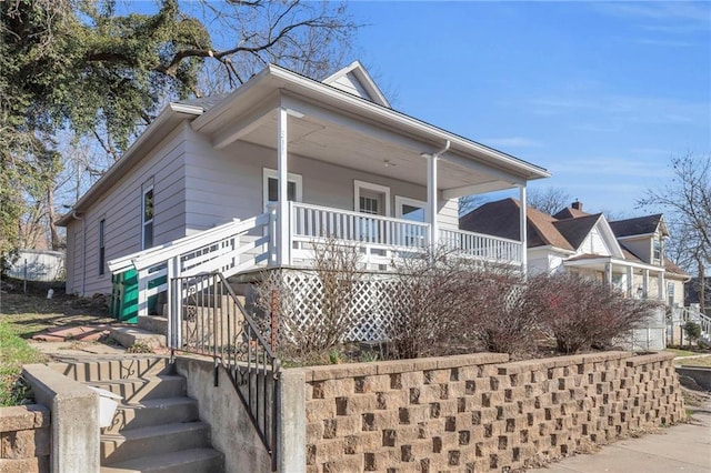 311 N Silver St, Paola, KS 66071 - view of front facade with stairs and covered porch