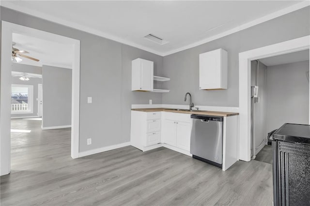 311 N Silver St, Paola, KS 66071 - kitchen with stainless steel dishwasher, a sink, light wood-type flooring, and ceiling fan