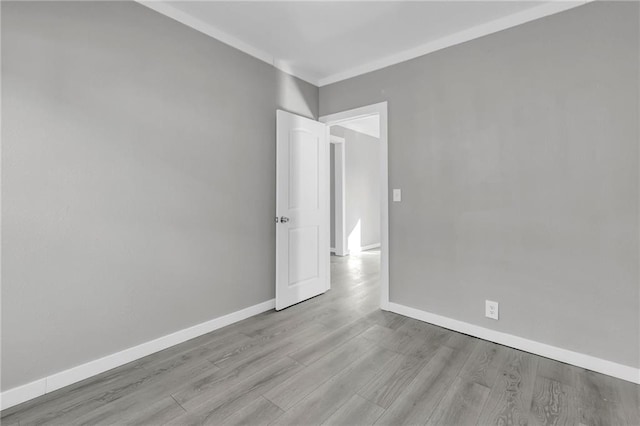 311 N Silver St, Paola, KS 66071 - unfurnished room featuring baseboards and wood finished floors