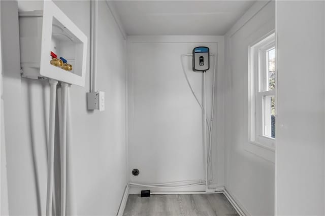 311 N Silver St, Paola, KS 66071 - laundry room featuring wood finished floors