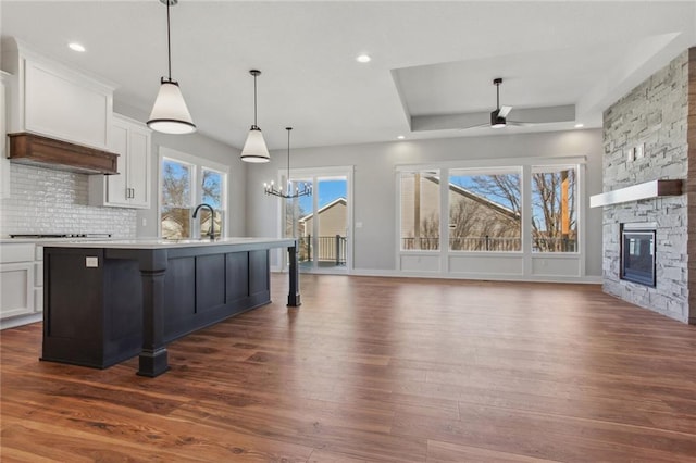 12425 NW Empress St, Platte City, MO 64079 - kitchen with dark wood-style floors, a ceiling fan, open floor plan, white cabinetry, and recessed lighting