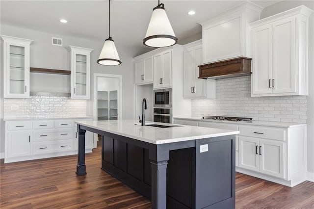 12425 NW Empress St, Platte City, MO 64079 - kitchen with a sink, stainless steel appliances, tasteful backsplash, light countertops, and white cabinets