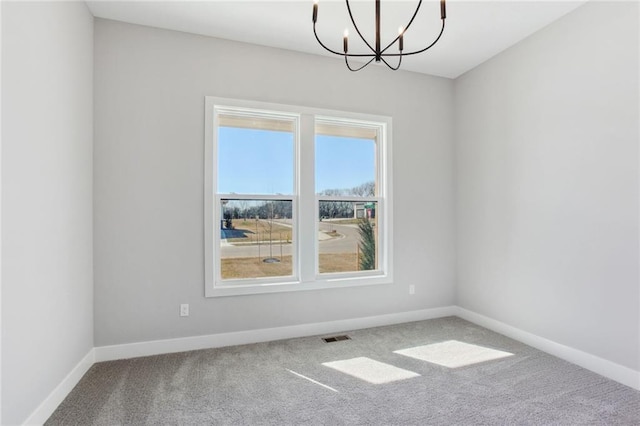 12425 NW Empress St, Platte City, MO 64079 - carpeted spare room with a chandelier and baseboards
