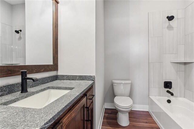 12425 NW Empress St, Platte City, MO 64079 - bathroom featuring vanity, toilet, wood finished floors, baseboards, and bathtub / shower combination