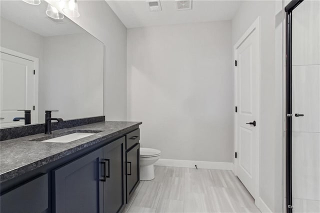 12425 NW Empress St, Platte City, MO 64079 - bathroom featuring vanity, toilet, and baseboards