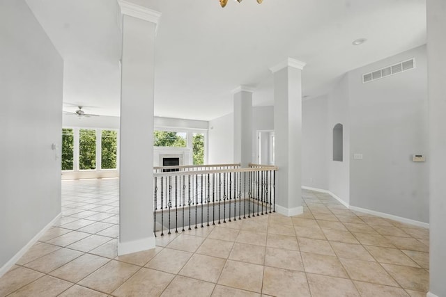 165 NE Hidden Ridge Ln, Lees Summit, MO 64064 - empty room with ceiling fan, tile patterned flooring, baseboards, and a fireplace