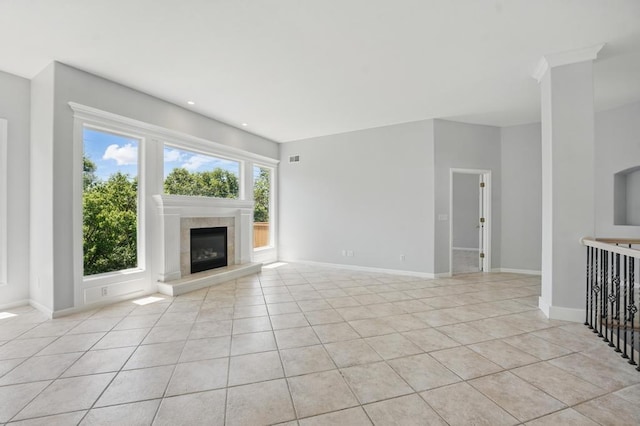 165 NE Hidden Ridge Ln, Lees Summit, MO 64064 - unfurnished living room featuring light tile patterned flooring, a fireplace, baseboards, and recessed lighting