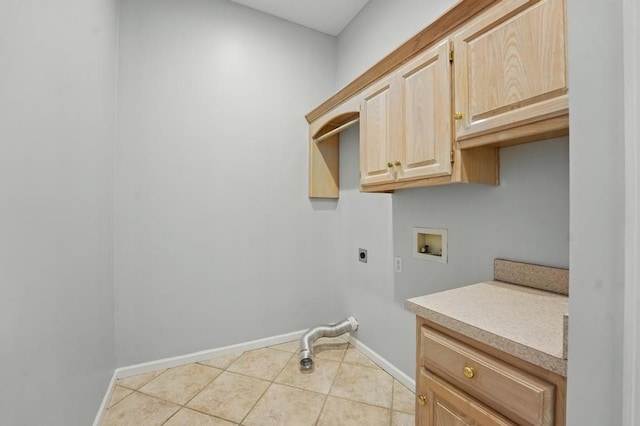 165 NE Hidden Ridge Ln, Lees Summit, MO 64064 - washroom featuring electric dryer hookup, hookup for a washing machine, baseboards, cabinet space, and light tile patterned floors