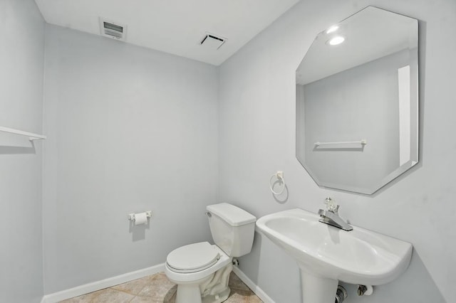 165 NE Hidden Ridge Ln, Lees Summit, MO 64064 - bathroom with toilet, baseboards, and a sink