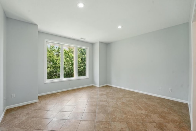 165 NE Hidden Ridge Ln, Lees Summit, MO 64064 - empty room featuring light tile patterned flooring, baseboards, and recessed lighting