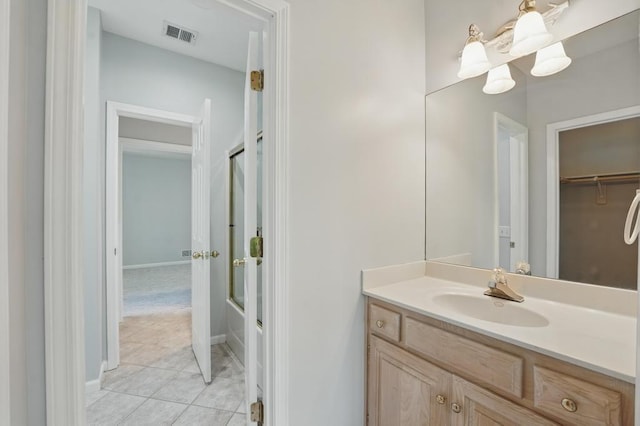 165 NE Hidden Ridge Ln, Lees Summit, MO 64064 - bathroom featuring vanity, tile patterned flooring, and baseboards