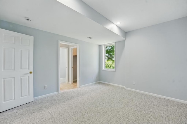 165 NE Hidden Ridge Ln, Lees Summit, MO 64064 - unfurnished bedroom featuring light carpet and baseboards