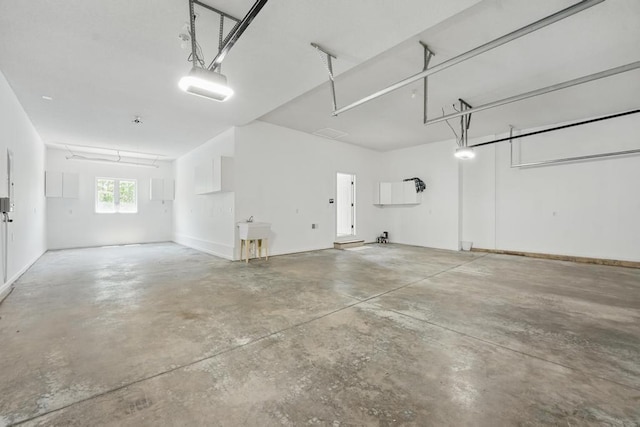165 NE Hidden Ridge Ln, Lees Summit, MO 64064 - garage featuring a garage door opener