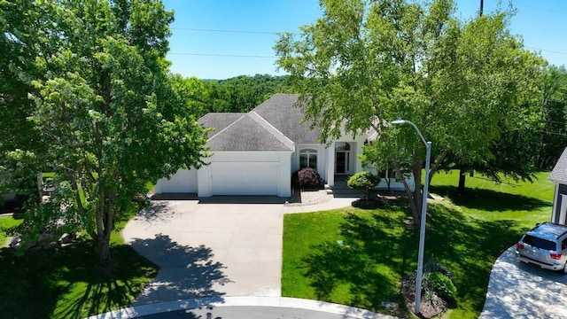 165 NE Hidden Ridge Ln, Lees Summit, MO 64064 - view of front of house featuring driveway, a front yard, an attached garage, roof with shingles, and stucco siding