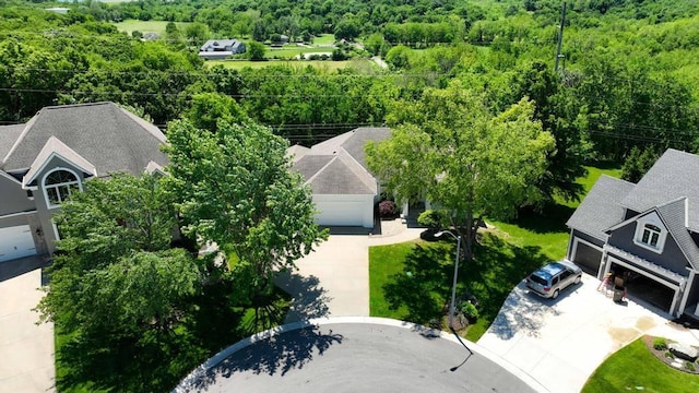165 NE Hidden Ridge Ln, Lees Summit, MO 64064 - view of subject property with a heavily wooded area