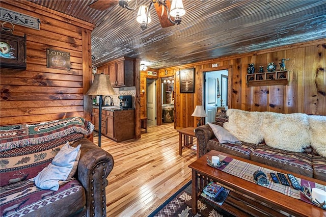 26406 Waterview Dr, Warsaw, MO 65355 - living room featuring wood walls, wooden ceiling, and light wood finished floors
