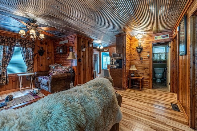 26406 Waterview Dr, Warsaw, MO 65355 - bedroom with wooden walls and light wood-type flooring