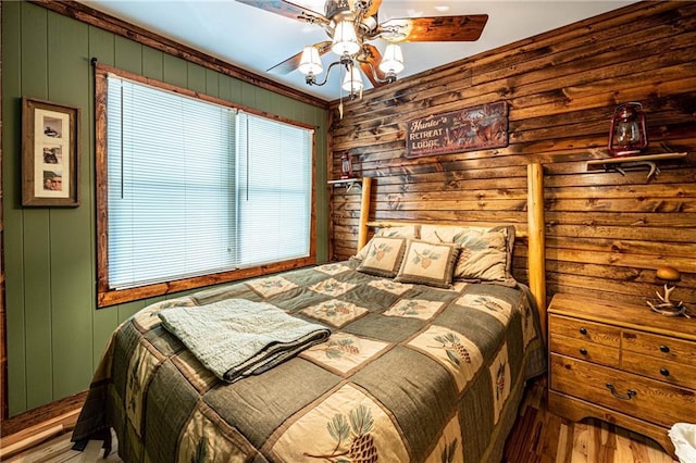26406 Waterview Dr, Warsaw, MO 65355 - bedroom featuring wood finished floors, wooden walls, and ceiling fan