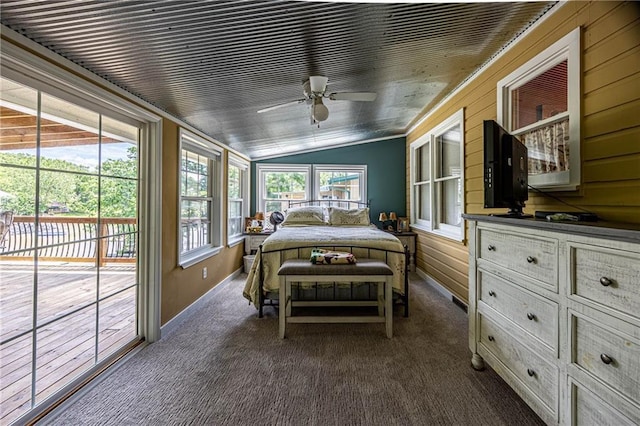 26406 Waterview Dr, Warsaw, MO 65355 - bedroom featuring lofted ceiling, access to exterior, dark colored carpet, and baseboards