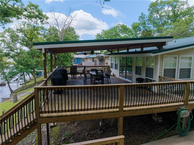26406 Waterview Dr, Warsaw, MO 65355 - wooden terrace featuring outdoor dining space and a water view