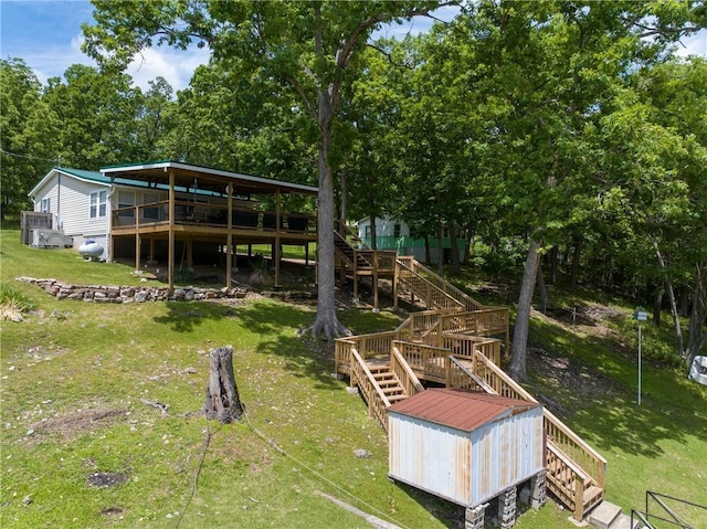 26406 Waterview Dr, Warsaw, MO 65355 - view of green lawn featuring stairway and a wooden deck