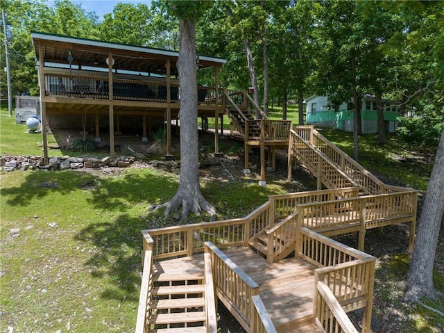 26406 Waterview Dr, Warsaw, MO 65355 - back of house featuring stairs, a wooden deck, and a yard