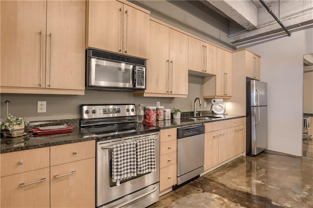 360 W Pershing Rd Unit 250, Kansas City, MO 64108 - kitchen with appliances with stainless steel finishes, light brown cabinets, and a sink