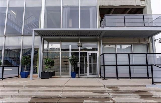 360 W Pershing Rd Unit 250, Kansas City, MO 64108 - doorway to property featuring french doors