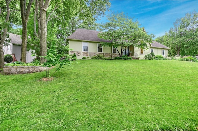 12000 Overbrook Rd, Leawood, KS 66209 - view of front of home with stucco siding, stone siding, and a front lawn