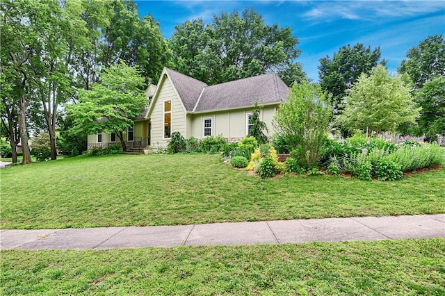 12000 Overbrook Rd, Leawood, KS 66209 - view of front of house with a front lawn and roof with shingles