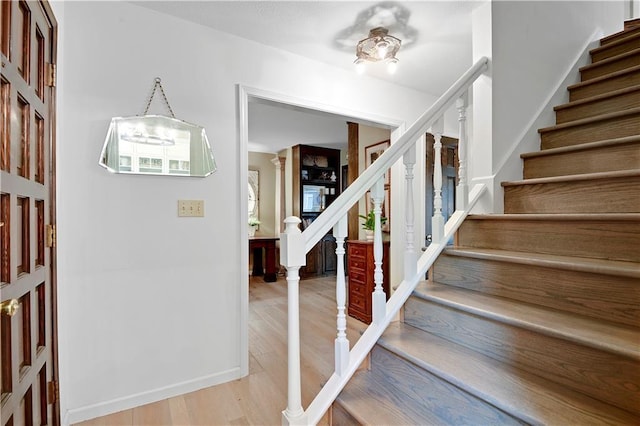 12000 Overbrook Rd, Leawood, KS 66209 - stairway featuring wood finished floors and baseboards