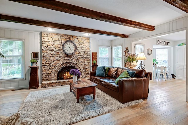 12000 Overbrook Rd, Leawood, KS 66209 - living area with light wood-style floors, beam ceiling, and a fireplace
