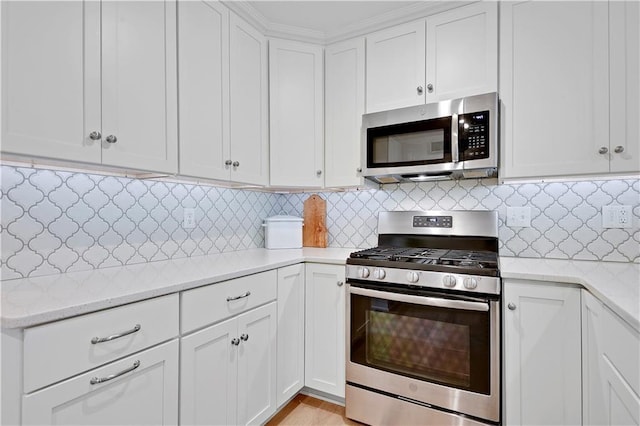 12000 Overbrook Rd, Leawood, KS 66209 - kitchen with appliances with stainless steel finishes, white cabinetry, decorative backsplash, and light stone counters