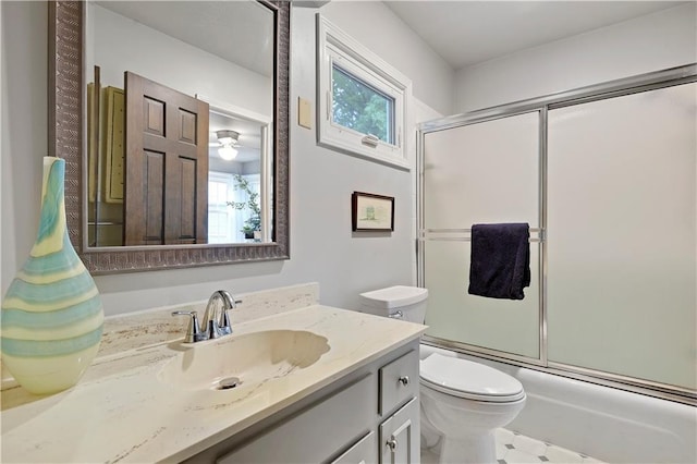 12000 Overbrook Rd, Leawood, KS 66209 - bathroom with vanity, toilet, healthy amount of natural light, and enclosed tub / shower combo