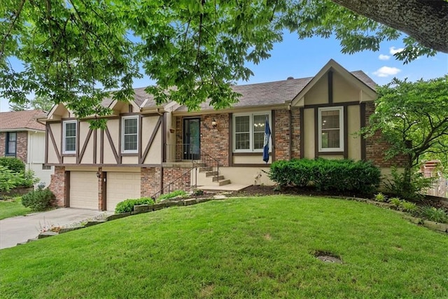 14613 S Locust St, Olathe, KS 66062 - view of front of house with stucco siding, driveway, a garage, and a front lawn