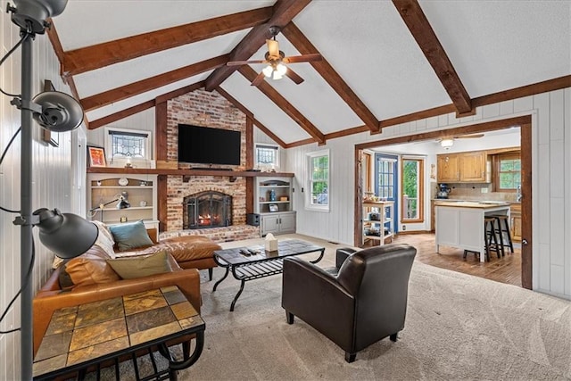 14613 S Locust St, Olathe, KS 66062 - living room featuring plenty of natural light, a ceiling fan, a brick fireplace, light colored carpet, and wooden walls