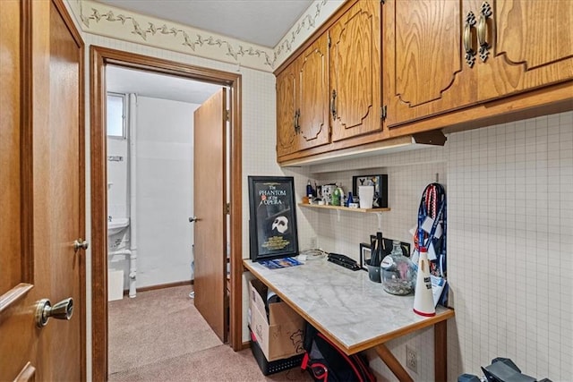 14613 S Locust St, Olathe, KS 66062 - kitchen featuring brown cabinetry, carpet floors, light countertops, and open shelves