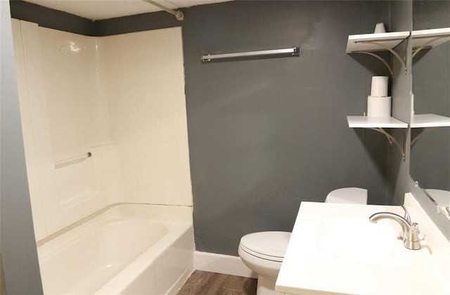 816 S Huttig Ave, Independence, MO 64053 - full bathroom featuring toilet, baseboards, wood finished floors, vanity, and shower / bath combination
