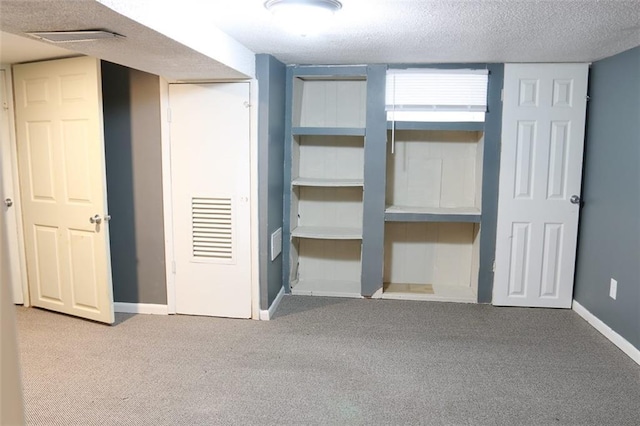 816 S Huttig Ave, Independence, MO 64053 - unfurnished bedroom featuring carpet flooring, baseboards, and a textured ceiling