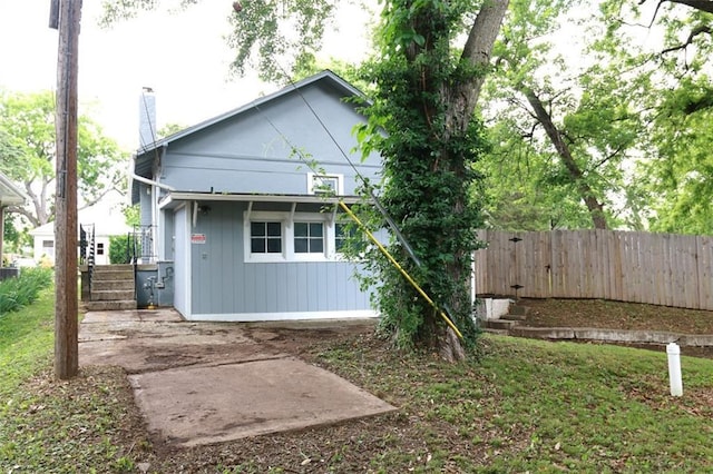816 S Huttig Ave, Independence, MO 64053 - rear view of house with a chimney