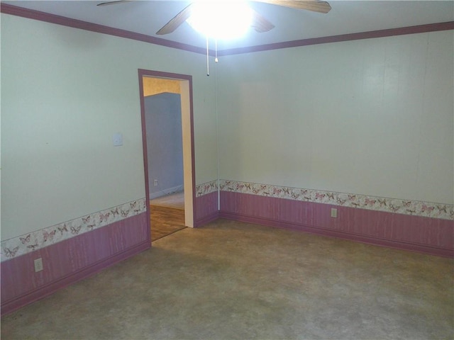 220 W State St, Erie, KS 66733 - carpeted spare room featuring ceiling fan, ornamental molding, wainscoting, and wood walls
