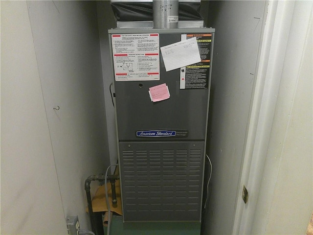 220 W State St, Erie, KS 66733 - utility room featuring heating unit
