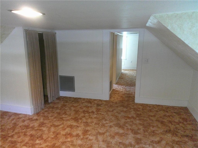 220 W State St, Erie, KS 66733 - additional living space featuring carpet flooring, baseboards, and lofted ceiling